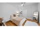 Cozy bedroom with hardwood floors, natural light, and tasteful decor, perfect for relaxation at 1188 Woodtrace Ln, Auburn, GA 30011