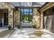 Charming home with a stone facade, a bench, and manicured landscaping at 1188 Woodtrace Ln, Auburn, GA 30011