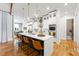 Bright, modern kitchen features a large island with seating, stainless steel appliances, and white cabinetry at 1188 Woodtrace Ln, Auburn, GA 30011