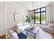 Cozy living room featuring modern decor, a large window, and natural light at 1188 Woodtrace Ln, Auburn, GA 30011