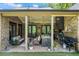 Outdoor kitchen with stainless steel appliances, a built-in grill, and comfortable seating at 1188 Woodtrace Ln, Auburn, GA 30011