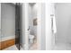 Clean powder room featuring light gray walls, a modern toilet, and hardwood flooring at 1188 Woodtrace Ln, Auburn, GA 30011