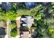 Aerial view of the home's roof, backyard, and mature trees surrounding the property at 1315 Badingham Dr, Cumming, GA 30041