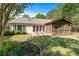 This backyard offers a charming screened porch, patio, and manicured lawn at 1315 Badingham Dr, Cumming, GA 30041