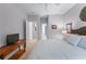 Simple bedroom with a comfortable bed, and view into the ensuite bathroom at 1315 Badingham Dr, Cumming, GA 30041