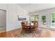 Bright dining room features a table with seating for 6 and large windows that let in natural light at 1315 Badingham Dr, Cumming, GA 30041