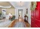 Elegant foyer with hardwood floors, decorative chandelier, and views into the living spaces at 1315 Badingham Dr, Cumming, GA 30041