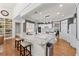 Spacious kitchen boasts granite counters, center island with seating, and an open layout at 1315 Badingham Dr, Cumming, GA 30041