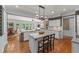 Spacious kitchen with granite countertops, white cabinets, and stainless steel appliances at 1315 Badingham Dr, Cumming, GA 30041