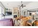 Cozy living room features a fireplace, built-in shelving, and a ceiling fan for added comfort at 1315 Badingham Dr, Cumming, GA 30041