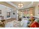Bright living room with hardwood floors, stylish decor, and large windows offering ample light at 1315 Badingham Dr, Cumming, GA 30041