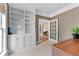 Bright office featuring custom built-in shelving for storage and organization at 1315 Badingham Dr, Cumming, GA 30041
