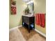 Well-lit bathroom with a modern vanity, neutral tones, and updated tile flooring at 6851 Roswell Rd # B15, Sandy Springs, GA 30328