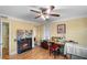 Cozy bedroom with laminate flooring and a fireplace, perfect for a home office or craft room at 6851 Roswell Rd # B15, Sandy Springs, GA 30328