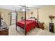 Serene bedroom with four poster bed, a ceiling fan, and ample natural light from the window at 6851 Roswell Rd # B15, Sandy Springs, GA 30328