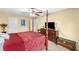 Spacious bedroom with a four-poster bed, a ceiling fan, and elegant furnishings at 6851 Roswell Rd # B15, Sandy Springs, GA 30328
