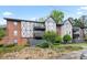Well-maintained exterior view of a two-story apartment building with landscaped grounds at 6851 Roswell Rd # B15, Sandy Springs, GA 30328