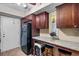 Compact kitchen featuring granite counters, bar seating, and stainless steel appliances at 6851 Roswell Rd # B15, Sandy Springs, GA 30328