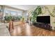 Bright living room with wood floors, a large window, and neutral decor at 6851 Roswell Rd # B15, Sandy Springs, GA 30328
