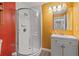Bathroom featuring a stand up shower, vanity with mirror and bright colored walls at 928 Rocky Creek Rd, Hampton, GA 30228