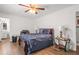 Relaxing bedroom with hardwood floors and a ceiling fan at 928 Rocky Creek Rd, Hampton, GA 30228
