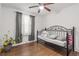 Bedroom with wood floor, daybed, and natural light from a window at 928 Rocky Creek Rd, Hampton, GA 30228