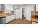 Well-lit kitchen with white cabinetry and butcher block countertops at 928 Rocky Creek Rd, Hampton, GA 30228