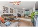 Cozy living area featuring hardwood floors, recessed lighting, comfortable seating, and natural light at 928 Rocky Creek Rd, Hampton, GA 30228