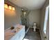 Bathroom featuring granite countertops, gold hardware and a glass enclosed shower with marble patterned walls at 169 Long Dr, Marietta, GA 30060