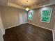 Spacious bedroom with hardwood floors, tray ceiling and decorative chandelier at 169 Long Dr, Marietta, GA 30060