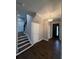Entryway with hardwood floors, staircase, and elegant chandelier at 169 Long Dr, Marietta, GA 30060