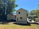 Back exterior elevation with a wooden deck and a covered carport at 169 Long Dr, Marietta, GA 30060