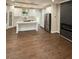 Spacious kitchen features a large island, stainless steel appliances, modern cabinets, and sleek hardwood floors at 169 Long Dr, Marietta, GA 30060