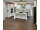 Bright kitchen featuring white cabinets, stainless steel appliances, marble countertops, and a spacious center island at 169 Long Dr, Marietta, GA 30060