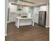 Modern kitchen with white cabinetry, stainless steel appliances, gas cooktop, and large island for entertaining at 169 Long Dr, Marietta, GA 30060