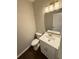 Powder room with marble countertop and modern fixtures at 169 Long Dr, Marietta, GA 30060