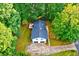 Aerial view of a two-story home with a two car garage, deck and driveway at 2152 Tourney Dr, Marietta, GA 30062