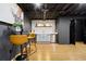 Finished basement with bar area, featuring stainless steel appliances and modern furniture at 2152 Tourney Dr, Marietta, GA 30062