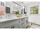 Bright bathroom with double vanity, updated lighting and fixtures, and neutral paint at 2152 Tourney Dr, Marietta, GA 30062