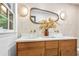Bathroom featuring double vanity, unique mirror, and modern lighting at 2152 Tourney Dr, Marietta, GA 30062