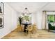 Bright dining room with modern lighting and views of backyard at 2152 Tourney Dr, Marietta, GA 30062