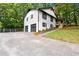 Two-story house with a two-car garage and a well-maintained lawn at 2152 Tourney Dr, Marietta, GA 30062