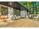 Charming front porch features stylish seating and a view of the lovely landscaped yard at 2152 Tourney Dr, Marietta, GA 30062