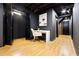 Hallway with wood floors, black walls, white trim, and black doors at 2152 Tourney Dr, Marietta, GA 30062