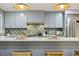Bright kitchen with white countertops, stainless steel appliances, and green tile backsplash at 2152 Tourney Dr, Marietta, GA 30062