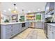 Gray kitchen cabinets, stainless appliances, and wood floors create a warm and inviting space at 2152 Tourney Dr, Marietta, GA 30062
