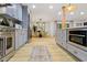Open kitchen with stainless steel appliances, grey cabinets, and dining area at 2152 Tourney Dr, Marietta, GA 30062