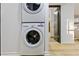 Laundry closet in hall with stacked washer and dryer at 2152 Tourney Dr, Marietta, GA 30062