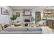 Cozy living room with stone fireplace, comfortable seating, and wood floors throughout the room at 2152 Tourney Dr, Marietta, GA 30062