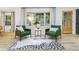 Living room with elegant chairs, bay window and modern decor at 2152 Tourney Dr, Marietta, GA 30062